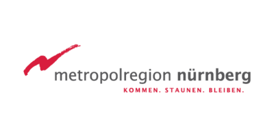 Logo der Metropolregion Nürnberg. Roter Blitz mit dem Zusatz "Kommen", "Staunen", "Bleiben